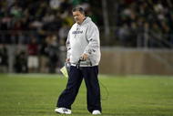 PALO ALTO, CA - NOVEMBER 28:  Notre Dame head coach Charlie Weis walks back to the sideline after speaking to his team during their game against the Stanford Cardinal at Stanford Stadium on November 28, 2009 in Palo Alto, California.  (Photo by Ezra Shaw/Getty Images)