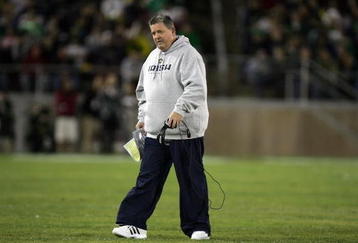 PALO ALTO, CA - NOVEMBER 28:  Notre Dame head coach Charlie Weis walks back to the sideline after speaking to his team during their game against the Stanford Cardinal at Stanford Stadium on November 28, 2009 in Palo Alto, California.  (Photo by Ezra Shaw/Getty Images)