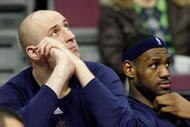 AUBURN HILLS, MI - MARCH 29:  (L-R) Zydrunas Ilgauskas #11 and LeBron James #23 of the Cleveland Cavaliers look on from the bench late in the fourth quarter against the Detroit Pistons at the Palace of Auburn Hills on March 29, 2008 in Auburn Hills, Michigan.  NOTE TO USER: User expressly acknowledges and agrees that, by downloading and or using this photograph, User is consenting to the terms and conditions of the Getty Images License Agreement.  (Photo by Gregory Shamus/Getty Images)