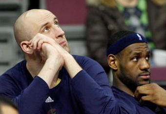 AUBURN HILLS, MI - MARCH 29:  (L-R) Zydrunas Ilgauskas #11 and LeBron James #23 of the Cleveland Cavaliers look on from the bench late in the fourth quarter against the Detroit Pistons at the Palace of Auburn Hills on March 29, 2008 in Auburn Hills, Michigan.  NOTE TO USER: User expressly acknowledges and agrees that, by downloading and or using this photograph, User is consenting to the terms and conditions of the Getty Images License Agreement.  (Photo by Gregory Shamus/Getty Images)