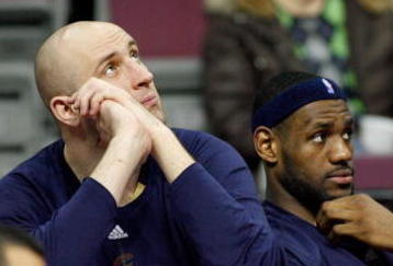AUBURN HILLS, MI - MARCH 29:  (L-R) Zydrunas Ilgauskas #11 and LeBron James #23 of the Cleveland Cavaliers look on from the bench late in the fourth quarter against the Detroit Pistons at the Palace of Auburn Hills on March 29, 2008 in Auburn Hills, Michigan.  NOTE TO USER: User expressly acknowledges and agrees that, by downloading and or using this photograph, User is consenting to the terms and conditions of the Getty Images License Agreement.  (Photo by Gregory Shamus/Getty Images)