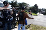 WINDERMERE, FL - NOVEMBER 30: Media park outside of the Isleworth community, which is home to Tiger Woods on November 30, 2009 in Windermere, Florida. Tiger Woods has not spoken with media or Florida Highway Patrol since he drove his SUV into a fire hydrant and tree outside his Florida home in the early hours of November 27. (Photo by Gerardo Mora/Getty Images)