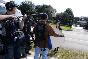 WINDERMERE, FL - NOVEMBER 30:   Media park outside of the Isleworth community, which is home to Tiger Woods on November 30, 2009 in Windermere, Florida. Tiger Woods has not spoken with media or Florida Highway Patrol since he drove his SUV into a fire hydrant and tree outside his Florida home in the early hours of November 27.  (Photo by Gerardo Mora/Getty Images)