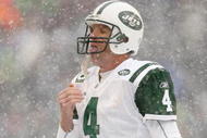 SEATTLE - DECEMBER 21:  Quarterback Brett Favre #4 of the New York Jets tastes some snow during the game against the Seattle Seahawks on December 21, 2008 at Qwest Field in Seattle, Washington. The Seahawks defeated the Jets 13-3. (Photo by Otto Greule Jr/Getty Images)