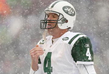 SEATTLE - DECEMBER 21:  Quarterback Brett Favre #4 of the New York Jets tastes some snow during the game against the Seattle Seahawks on December 21, 2008 at Qwest Field in Seattle, Washington. The Seahawks defeated the Jets 13-3. (Photo by Otto Greule Jr/Getty Images)