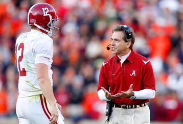 AUBURN, AL - NOVEMBER 27:  Head coach Nick Saban of the Alabama Crimson Tide converses with quarterback Greg McElroy #12 during the game against the Auburn Tigers at Jordan-Hare Stadium on November 27, 2009 in Auburn, Alabama.  (Photo by Kevin C. Cox/Getty Images)