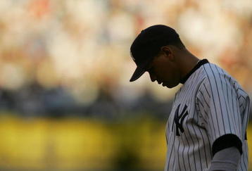 NEW YORK - JULY 6:  Infielder Alex Rodriguez #13 of the New York Yankees looks at the field during the game against the Detroit Tigers at Yankee Stadium on July 6, 2004 in the Bronx, New York.  The Tigers defeated the Yankees 9-1.  (Photo by Ezra Shaw/Getty Images)