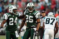 EAST RUTHERFORD, NJ - NOVEMBER 29:  Kerry Rhodes #25 of the New York Jets celebrates his second interception of the game against the Carolina Panthers with teammate Darrelle Revis #24 on November 29, 2009 at Giants Stadium in East Rutherford, New Jersey. The Jets defeated the Panthers 17-6.  (Photo by Jim McIsaac/Getty Images)