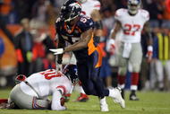 DENVER - NOVEMBER 26:  D.J. Williams #55 of the Denver Broncos reacts after sacking quarterback Eli Manning #10 of the New York Giants during NFL action at Invesco Field at Mile High on November 26, 2009 in Denver, Colorado. The Broncos defeated the Giants 26-6.  (Photo by Doug Pensinger/Getty Images)