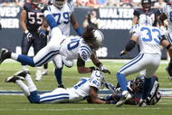HOUSTON - NOVEMBER 29:  Wide receiver Andre Jophnson #80 of the Houston Texans is tackled by defensive back Jacob Lacey #27 and linebacker Philip Wheeler #50 of the Indianapolis Colts at Reliant Stadium on November 29, 2009 in Houston, Texas.  (Photo by Bob Levey/Getty Images)