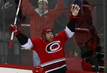 RALEIGH, NC - NOVEMBER 19: Erik Cole #26 (C) of the Carolina Hurricanes scores at 19:57 of the third period against the Toronto Maple Leafs to tie the score at 5-5 at the RBC Center on November 19, 2009 in Raleigh, North Carolina. The Hurricanes defeated the Maple Leafs 6-5 in the shoot out. (Photo by Bruce Bennett/Getty Images)