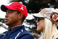 SAN FRANCISCO - OCTOBER 11:  Tiger Woods of the USA Team waits with his wife Elin on the 13th green during the Final Round Singles Matches of The Presidents Cup at Harding Park Golf Course on October 11, 2009 in San Francisco, California.  (Photo by Scott Halleran/Getty Images)