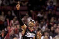 EAST RUTHERFORD, NJ - DECEMBER 10:  Allen Iverson #3 of the Philadelphia 76ers reacts to a basket scored against the New Jersey Nets during their game at Continental Airlines Arena on December 10, 2005 in East Rutherford, New Jersey. The Sixers defeated the Nets 107-95. NOTE TO USER: User expressly acknowledges and agrees that, by downloading and or using this photograph, User is consenting to the terms and conditions of the Getty Images License Agreement. (Photo by Jim McIsaac/Getty Images)             