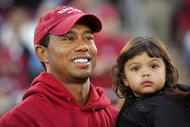 PALO ALTO, CA - NOVEMBER 21:  Honorary Standford Cardinal captain Tiger Woods holds his daugher, Sam, on the sidelines before the Cardinal game against the California Bears at Stanford Stadium on November 21, 2009 in Palo Alto, California.  (Photo by Ezra Shaw/Getty Images)
