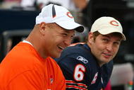 CHICAGO - OCTOBER 04: Injured linebacker Brian Urlacher of the Chicago Bears shares a laugh with Jay Cutler #6 on the bench during a game against the Detroit Lions on October 4, 2009 at Soldier Field in Chicago, Illinois. The Bears defeated the Lions 48-24.  (Photo by Jonathan Daniel/Getty Images)