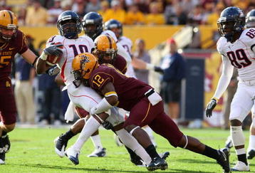 TEMPE, AZ - NOVEMBER 28:  Wide receiver William Wright #19 of the Arizona Wildcats is tackled by Matthew Tucker #12 of the Arizona State Sun Devils after a reception during the college football game at Sun Devil Stadium on November 28, 2009 in Tempe, Arizona. The Wildcats defeated the Sun Devils 20-17.  (Photo by Christian Petersen/Getty Images)