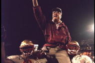 1 Jan 1996: Head coach Bobby Bowden of the Florida State Seminoles is carried triumphantly off the field by nose guard Andre Wadsworth #8 and tackle Orpheus Roy after defeating the Notre Dame Fighting Irish in the Orange Bowl in Miami, Florida 31-26. Ma