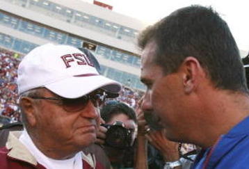 TALLAHASSEE, FL - NOVEMBER 25:  Head coach Bobby Bowden of the Florida State Seminoles congratulates head coach Urban Meyer of the Florida Gators after the Gators' victory at Doak Campbell Stadium November 25, 2006 in Tallahassee, Florida. Florida defeated Florida State 21-14.  (Photo by Doug Benc/Getty Images)