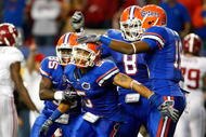 ATLANTA - DECEMBER 06:  Joe Hadan #5 of the Florida Gators celebrates with teammates after intercepting a pass in the final minutes of their 31-20 win over the Alabama Crimson Tide during the SEC Championship on December 6, 2008 at the Georgia Dome in Atlanta, Georgia.  (Photo by Kevin C. Cox/Getty Images)