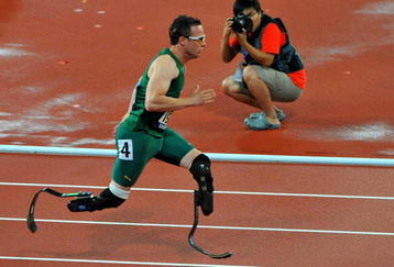 BEIJING, CHINA - SEPTEMBER 16:  Oscar Pistorius of South Africa wins Gold with a World Record in the 400m T44 during day 10 of the 2008 Beijing Paralympic Games held in Beijing, China.  (Photo by Duif du Toit/Gallo Images/Getty Images)