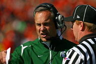 CHAMPAIGN, IL - OCTOBER 10: Head coach Mark Dantonio of the Michigan State Spartans argues with a referee during a game against the Illinois Fighting Illini on October 10, 2009 at Memorial Stadium at the University of Illinois in Champaign, Illinois. Michigan State defeated Illinois 24-14. (Photo by Jonathan Daniel/Getty Images)