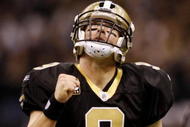 NEW ORLEANS - NOVEMBER 30: Quarterback Drew Brees #9 of the New Orleans Saints celebrates after a touchdown against the New England Patriots at Louisana Superdome on November 30, 2009 in New Orleans, Louisiana.  (Photo by Chris Graythen/Getty Images)