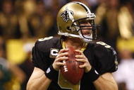 NEW ORLEANS - NOVEMBER 30: Quarterback Drew Brees #9 of the New Orleans Saints drops back to pass against the New England Patriots at Louisana Superdome on November 30, 2009 in New Orleans, Louisiana. (Photo by Scott Halleran/Getty Images)