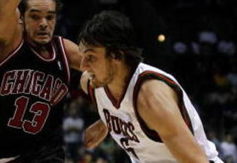 MILWAUKEE - NOVEMBER 30: Andrew Bogut #6 of the Milwuakee Bucks drives around Joakim Noah #13 of the Chicago Bulls at the Bradley Center on November 30, 2009 in Milwaukee, Wisconsin. The Bucks defeated the Bulls 99-97. NOTE TO USER: User expressly acknowledges and agrees that, by downloading and/or using this Photograph, User is consenting to the terms and conditions of the Getty Images License Agreement. (Photo by Jonathan Daniel/Getty Images)