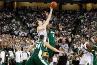 DETROIT - APRIL 06:  Travis Walton #5 of the Michigan State Spartans and Tyler Hansbrough #50 of the North Carolina Tar Heels go after a jump ball after the opening-tip had to be re-done during the 2009 NCAA Division I Men's Basketball National Championship game at Ford Field on April 6, 2009 in Detroit, Michigan.  (Photo by Streeter Lecka/Getty Images)