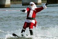 ARLINGTON, VA - DECEMBER 24:  Dressed as Santa Claus, Kerry Nistel water-skis on the waters of the Potomac River December 24, 2007 in Arlington, Virginia. This is the 22nd year Nistel has dressed as Santa and water-skied on Christmas Eve.  (Photo by Mark Wilson/Getty Images)