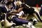 NEW ORLEANS - NOVEMBER 30: Tom Brady #12 of the New England Patriots is sacked in the second quarter of the game against the New Orleans Saints at Louisana Superdome on November 30, 2009 in New Orleans, Louisiana. (Photo by Chris Graythen/Getty Images)