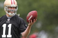 SANTA CLARA, CA - MAY 01:  Quarterback Alex Smith #11 of the San Francisco 49ers looks on during the 49ers Minicamp at their training facilities on May 1, 2009 in Santa Clara, California.  (Photo by Jed Jacobsohn/Getty Images)
