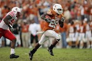 AUSTIN, TX - OCTOBER 27:  Running back Jamaal Charles #25 of the Texas Longhorns sprints to a 40-yard touchdown ahead of defensive end Barry Turner #99 of the Nebraska Cornhuskers at Darrell K Royal-Texas Memorial Stadium October 27, 2007 in Austin, Texas.  Charles broke the 1000 yard mark for the season and Texas won 28-25.  (Photo by Brian Bahr/Getty Images)