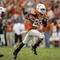 AUSTIN, TX - OCTOBER 27:  Running back Jamaal Charles #25 of the Texas Longhorns sprints to a 40-yard touchdown ahead of defensive end Barry Turner #99 of the Nebraska Cornhuskers at Darrell K Royal-Texas Memorial Stadium October 27, 2007 in Austin, Texas.  Charles broke the 1000 yard mark for the season and Texas won 28-25.  (Photo by Brian Bahr/Getty Images)