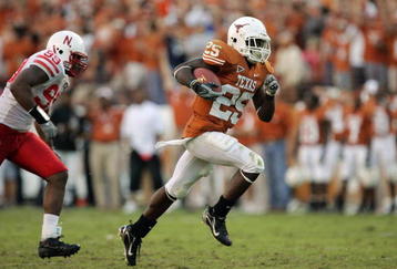 AUSTIN, TX - OCTOBER 27:  Running back Jamaal Charles #25 of the Texas Longhorns sprints to a 40-yard touchdown ahead of defensive end Barry Turner #99 of the Nebraska Cornhuskers at Darrell K Royal-Texas Memorial Stadium October 27, 2007 in Austin, Texas.  Charles broke the 1000 yard mark for the season and Texas won 28-25.  (Photo by Brian Bahr/Getty Images)
