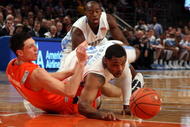 NEW YORK - NOVEMBER 20:  Will Graves #13 of the North Carolina Tar Heels battles for a loose ball against Andy Rautins #1 of the Syracuse Orange during the championship game of the 2K Sports Classic on November 20, 2009 at Madison Square Garden in New York City.  (Photo by Jim McIsaac/Getty Images)