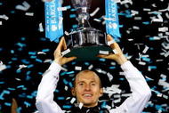 LONDON, ENGLAND - NOVEMBER 29:  Nikolay Davydenko of Russia holds the trophy as he celebrates winning the men's singles final match against Juan Martin Del Potro of Argentina during the Barclays ATP World Tour Finals at the O2 Arena on November 29, 2009 in London, England.  (Photo by Julian Finney/Getty Images)