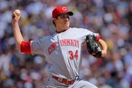 DENVER - SEPTEMBER 07:  Starting pitcher Homer Bailey #34 of the Cincinnati Reds delivers against the Colorado Rockies at Coors Field on September 7, 2009 in Denver, Colorado.  (Photo by Doug Pensinger/Getty Images)