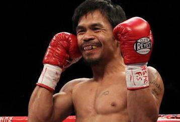 LAS VEGAS - NOVEMBER 14:  Manny Pacquiao smiles before taking on Miguel Cotto during their WBO welterweight title fight at the MGM Grand Garden Arena on November 14, 2009 in Las Vegas, Nevada.  (Photo by Al Bello/Getty Images)