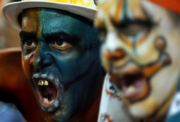 MIAMI - OCTOBER 12: Miami Dolphins fans scream at New York Jets fans prior to their game at Land Shark Stadium on October 12, 2009 in Miami, Florida.  (Photo by Marc Serota/Getty Images)