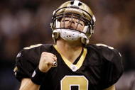 NEW ORLEANS - NOVEMBER 30: Quarterback Drew Brees #9 of the New Orleans Saints celebrates after a touchdown against the New England Patriots at Louisana Superdome on November 30, 2009 in New Orleans, Louisiana.  (Photo by Chris Graythen/Getty Images)