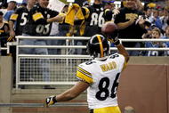 DETROIT , MI - OCTOBER 11:  Hines Ward #86 of the Pittsburgh Steelers celebrates a second quarter touchdown by throwing the ball to fans while playing the Detroit Lions on October 11, 2009 at Ford Field in Detroit, Michigan.  (Photo by Gregory Shamus/Getty Images)