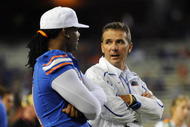 GAINESVILLE, FL - NOVEMBER 7: Coach Urban Meyer of the Florida Gators talks with suspended linebacker Brandon Spikes #51 before play against the Vanderbilt Commodores November 7, 2009 at Ben Hill Griffin Stadium in Gainesville, Florida.  (Photo by Al Messerschmidt/Getty Images)