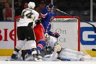 NEW YORK - NOVEMBER 30: Brooks Orpik #44 of the Pittsburgh Penguins propels Sean Avery #16 of the New York Rangers over goaltender Marc-Andre Fleury #29 at Madison Square Garden on November 30, 2009 in New York City. (Photo by Bruce Bennett/Getty Images)