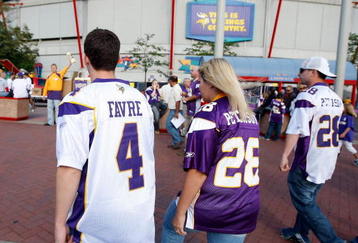 MINNEAPOLIS, MN - AUGUST 21: A fan wears a Brett Favre and Adrian Peterson jersey as they walk to the Metrodome prior to the game against the Minnesota Vikings against the Kansas City Chiefs at Hubert H. Humphrey Metrodome on August 21, 2009 in Minneapolis, Minnesota. (Photo by Scott Boehm/Getty Images)