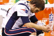NEW ORLEANS - NOVEMBER 30: Quarterback Tom Brady #12 of the New England Patriots sits dejected on the bench late in the fourth quarter against the New Orleans Saints at Louisana Superdome on November 30, 2009 in New Orleans, Louisiana. (Photo by Scott Halleran/Getty Images)
