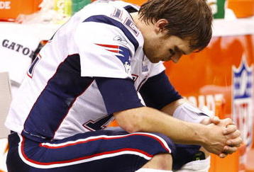 NEW ORLEANS - NOVEMBER 30: Quarterback Tom Brady #12 of the New England Patriots sits dejected on the bench late in the fourth quarter against the New Orleans Saints at Louisana Superdome on November 30, 2009 in New Orleans, Louisiana. (Photo by Scott Halleran/Getty Images)