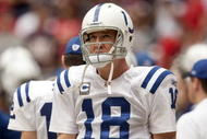 HOUSTON - NOVEMBER 29:  Quarterback Peyton Manning #18 of the Indianapolis Colts checks the scoreboard in the second quarter at Reliant Stadium on November 29, 2009 in Houston, Texas.  (Photo by Bob Levey/Getty Images)