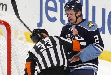 SUNRISE, FL - NOVEMBER 23: Keith Ballard #2 of the Florida Panthers has his mouth checked by referee Kevin Pollock #33 after he was hit by Sidney Crosby #87 (not pictured) of the Pittsburgh Penguins on November 23, 2009 at the BankAtlantic Center in Sunrise, Florida. (Photo by Joel Auerbach/Getty Images)