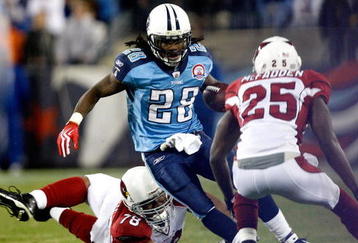 NASHVILLE, TN - NOVEMBER 29:  Teammates Alan Branch #78 and Bryant McFadden #25 of the Arizona Cardinals try to tackle Chris Johnson #28 of the Tennessee Titans during their game at LP Field on November 29, 2009 in Nashville, Tennessee.  (Photo by Streeter Lecka/Getty Images)